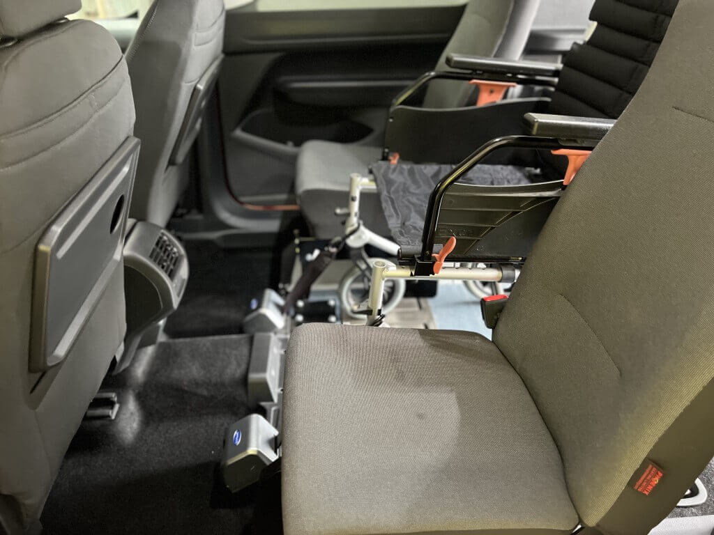 Ford Tourneo Connect Grand XL with 2 slim seats - View from the side door showing the wheelchair in position